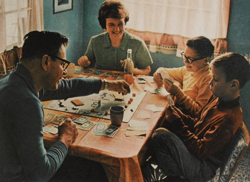 family-playing-monopoly-vintage